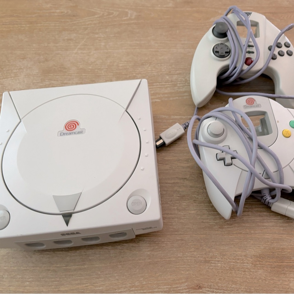 Practically new collectible Sega Dreamcast system, 2 controllers,various games